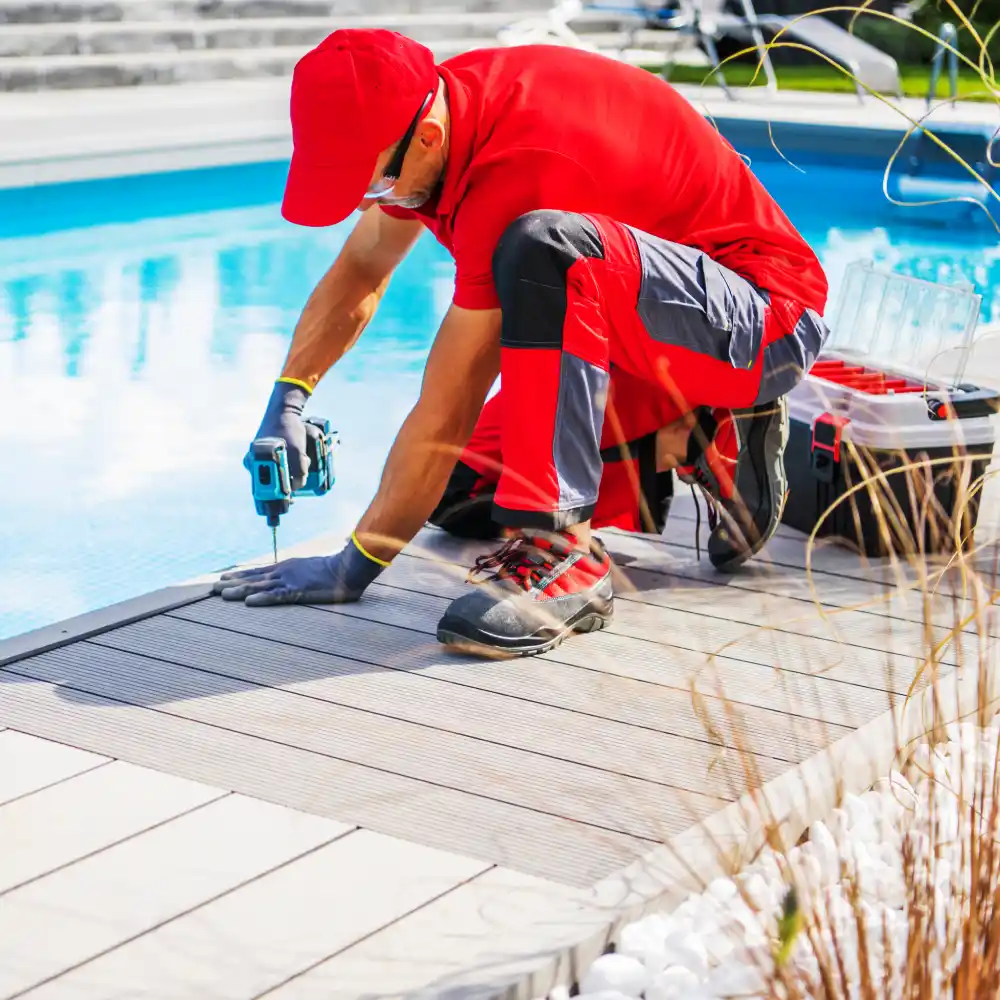 Professional Outdoor Swimming Pools Worker Finishing Composite Deck Installation