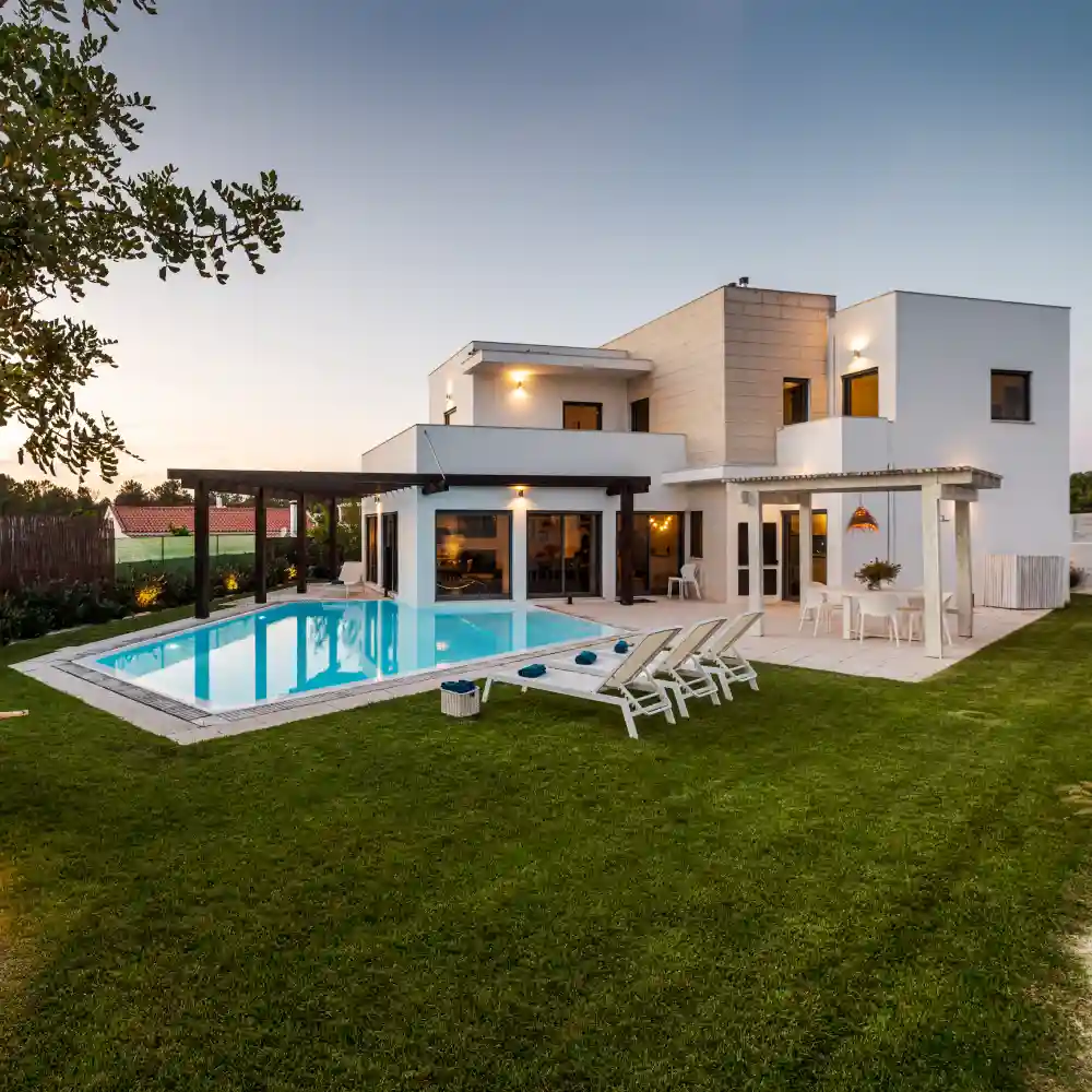 Aerial view of a villa’s rooftop with outdoor seating and pool area